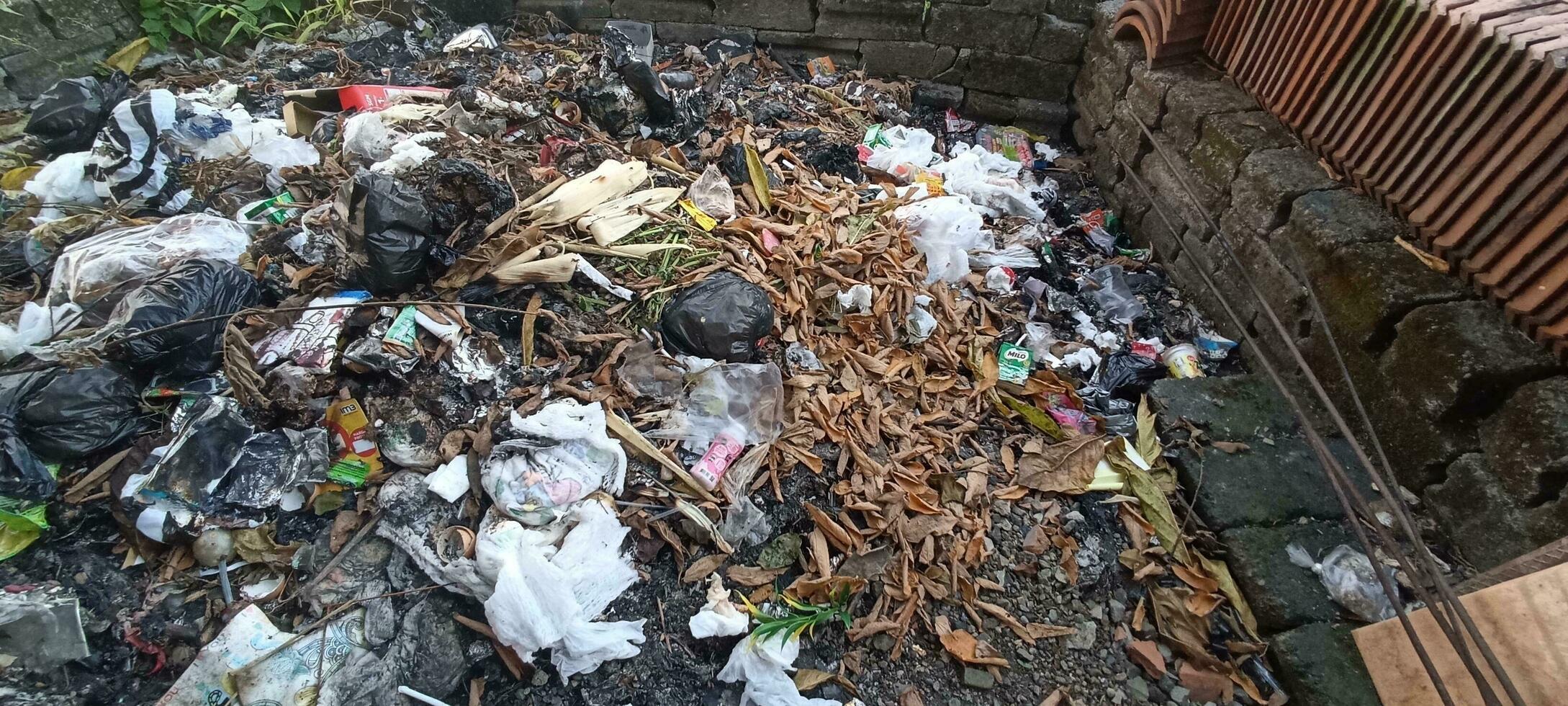 trash piled up in the dumps photo