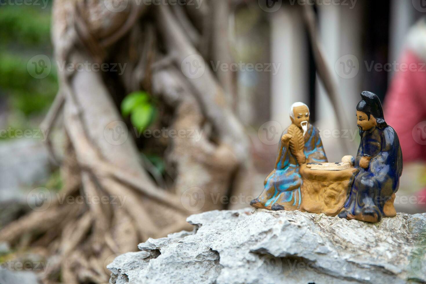 Vietnamese Figurines playing a game photo