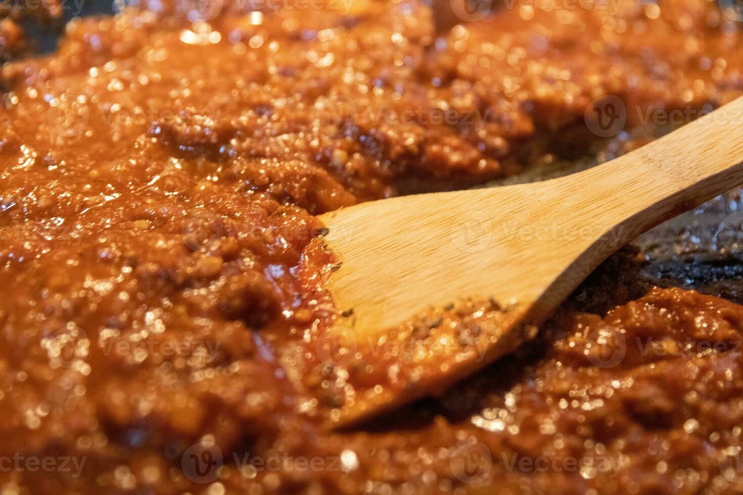 Beef tomato sauce being mixed photo