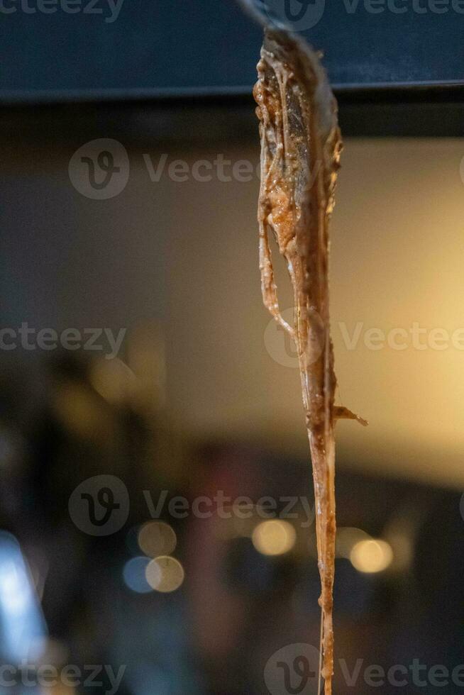 Fork with stringy cheese photo