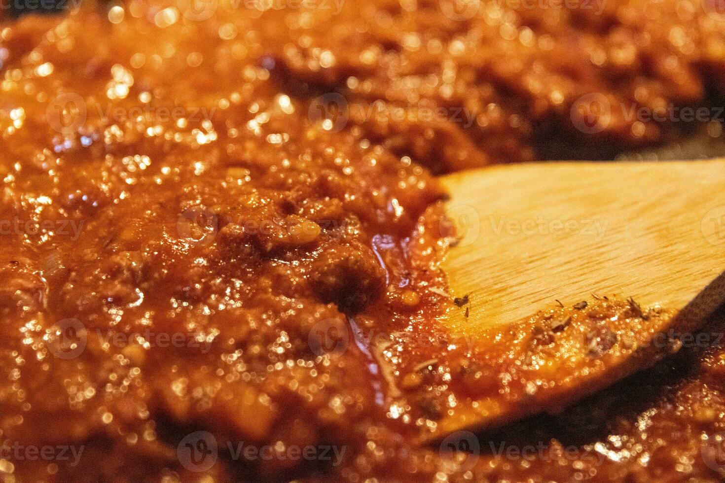 Mixing tomato beef sauce photo