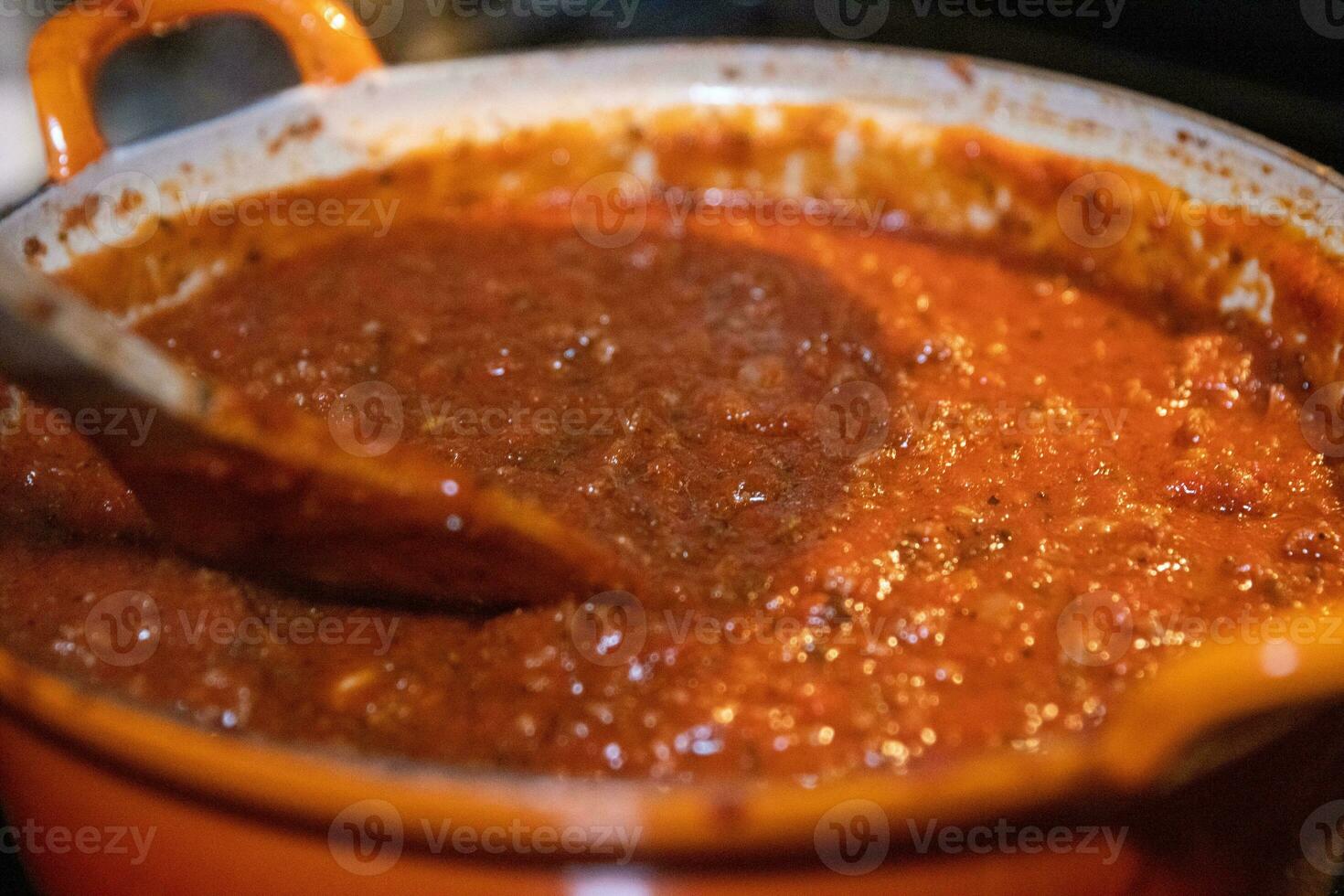 Mixing tomato beef sauce photo