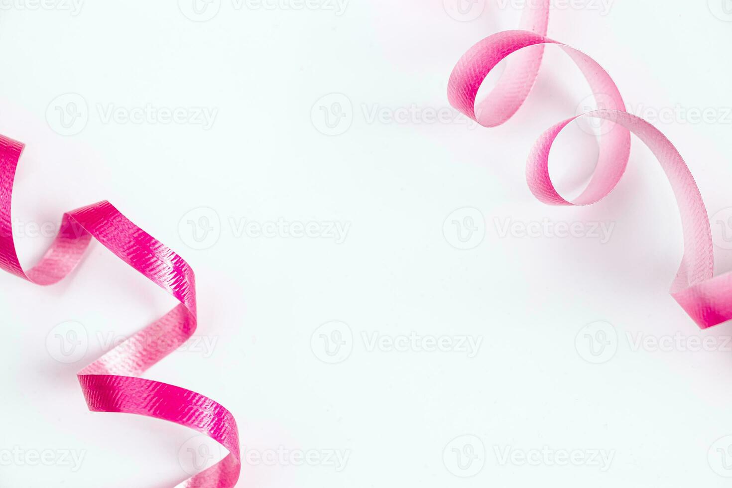 Pink ribbon for wrapping gifts on white background. photo