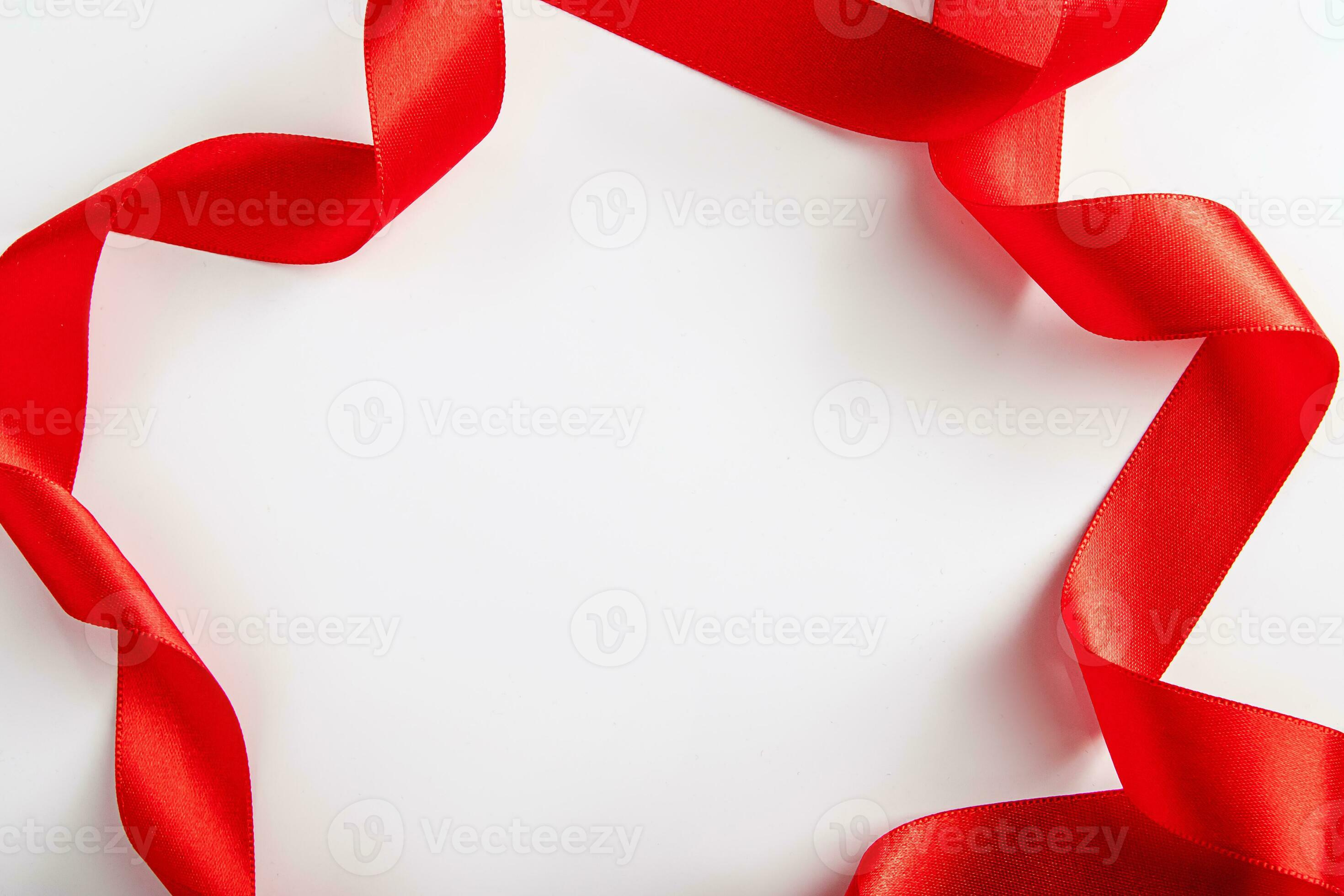 Red silk ribbon for wrapping gifts on white background. 24871843