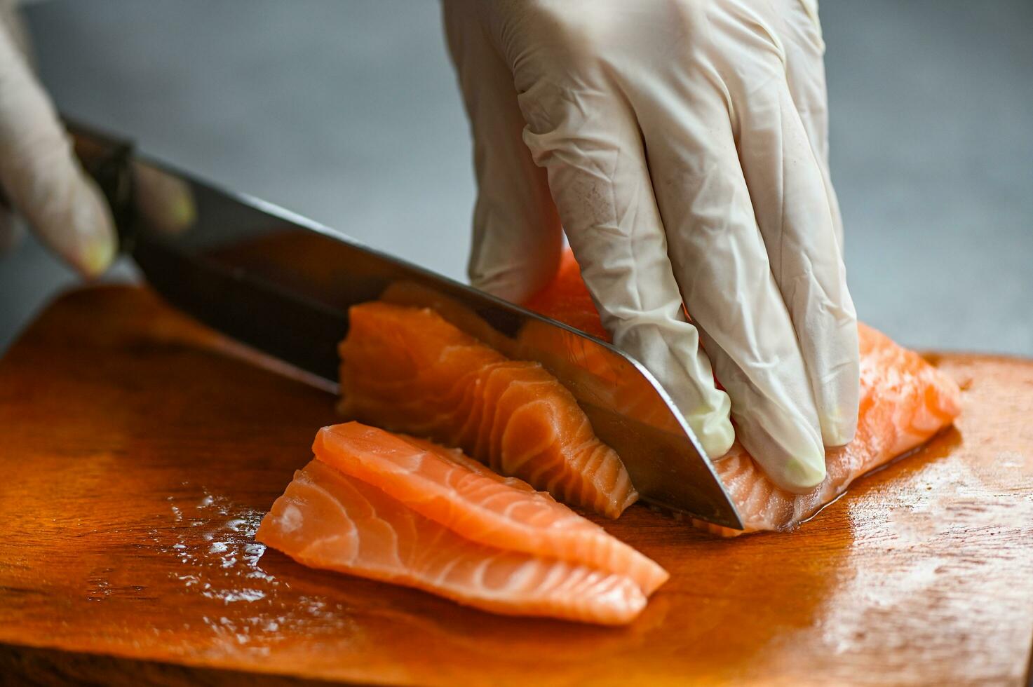 fresh raw salmon fish fillet with kitchen knife for cooking food seafood salmon fish, salmon fillet on wooden cutting board photo