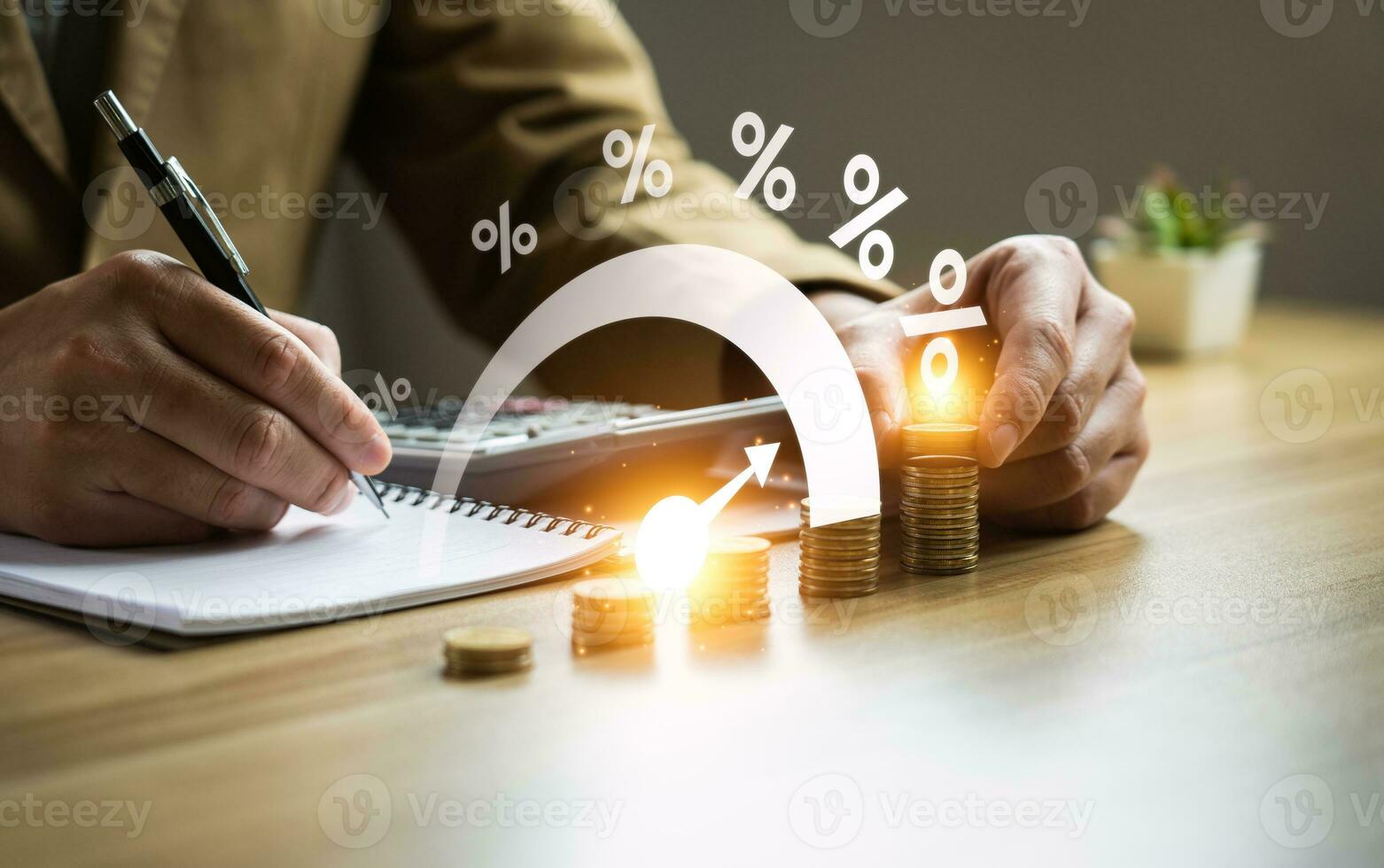 Interest rate and dividend concept, Businessman is calculating income and return on investment in percentage. income, return, retirement, compensation fund, investment, dividend tax, stock market photo