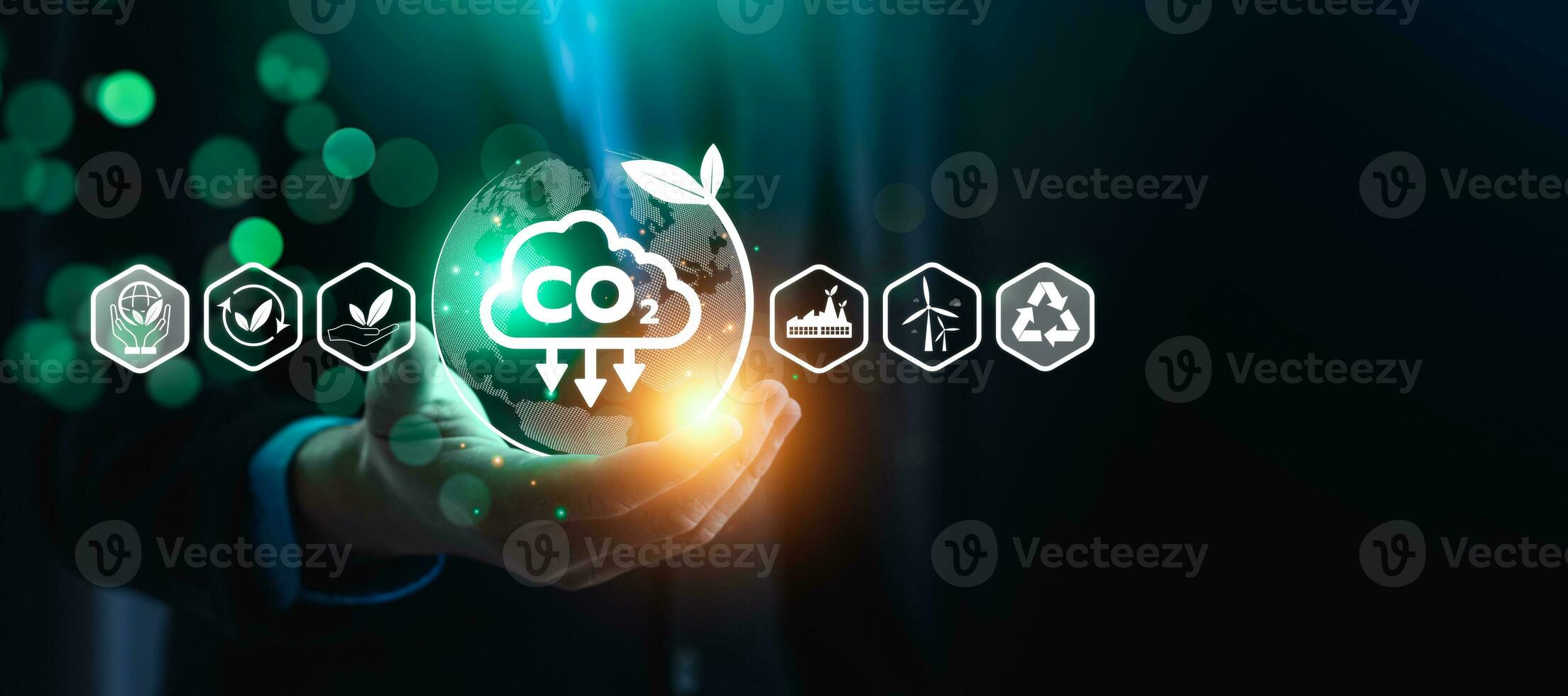 CO2 emission reduction concept, businessman with environmental technology Icons, global warming, sustainable development, renewable energy business. climate change, carbon capture, storage, reuse photo