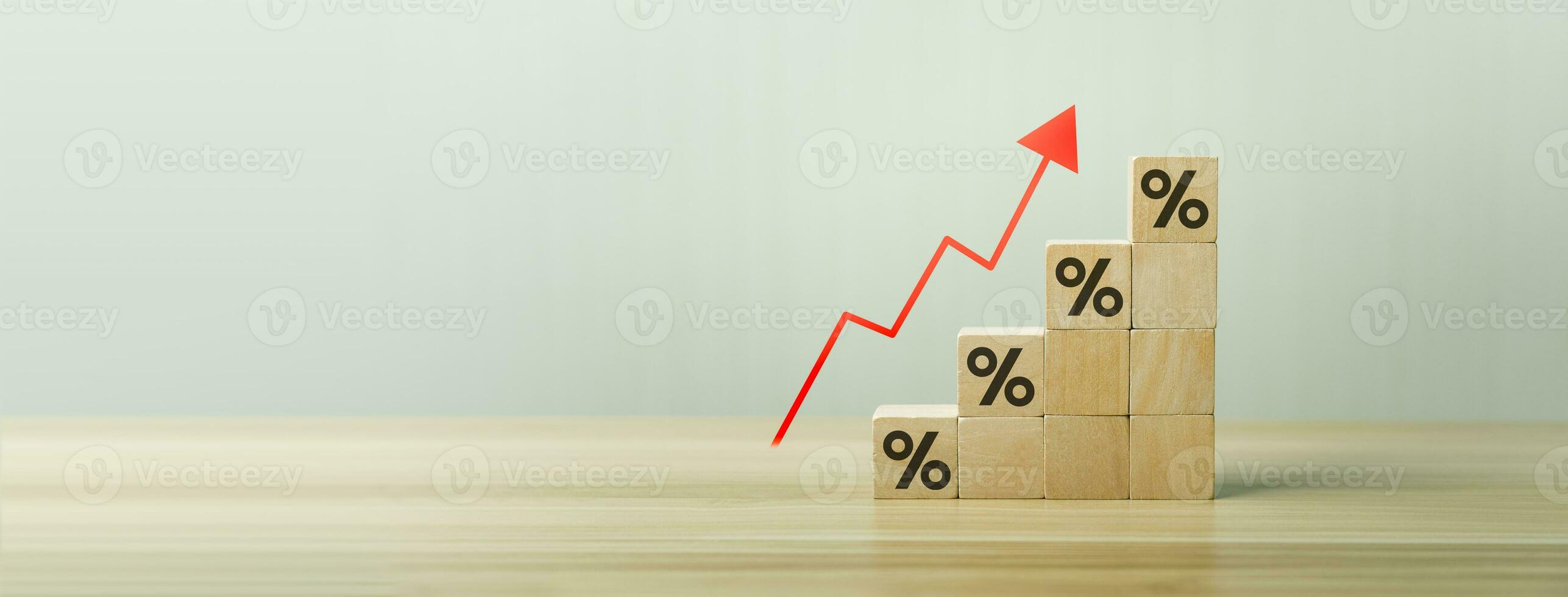 Interest rate financial and mortgage rates concept. Wooden blocks with Icon percentage symbol and arrow pointing up. company business growth and sales, interest rate, tax, real estate, inflation photo