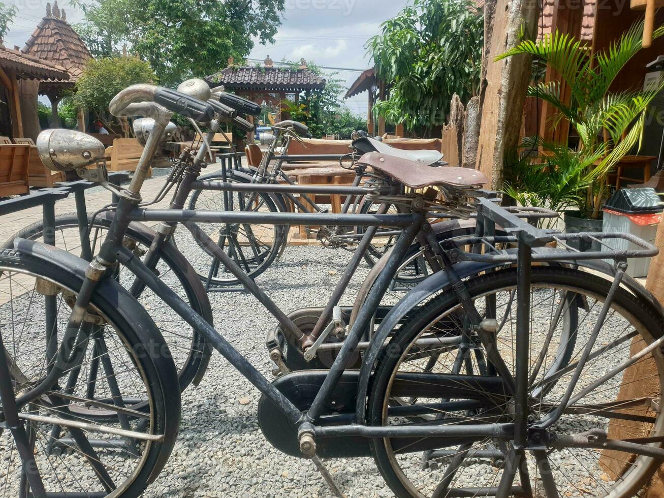 Old rusty bicycle detail. old bicycle,drive chain, wheel,rust. Blue bicycle. Sepeda tua. Sepeda Ontel. photo