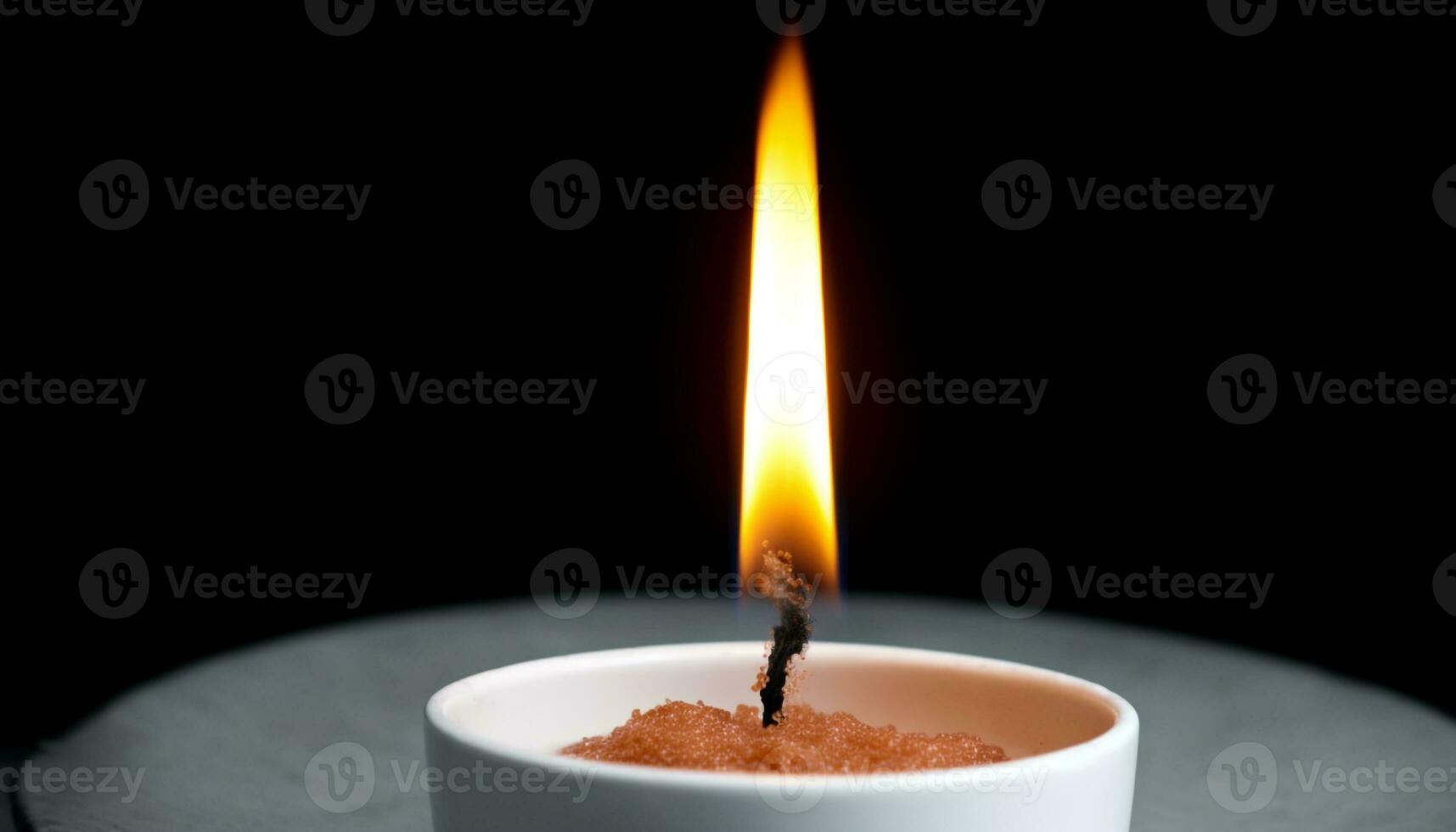 Glowing candle illuminates tranquil scene, symbolizing spirituality and harmony generated by AI photo