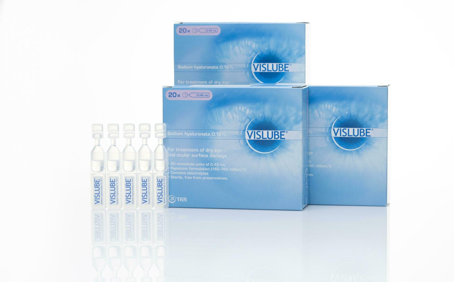 CHONBURI, THAILAND-MAY 3, 2023 Vislube artificial tears. Lubricating eye drops in plastic tube and blue package. Sodium hyaluronate eye drops for treatment dry eye. Artificial tears vial. Eye care. photo
