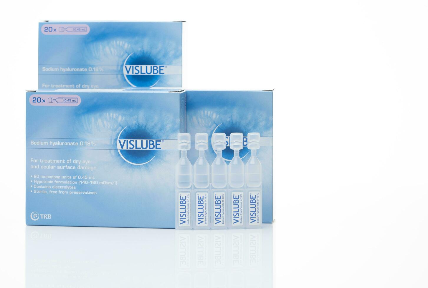 CHONBURI, THAILAND-MAY 3, 2023 Vislube artificial tears. Lubricating eye drops in plastic tube and blue package. Sodium hyaluronate eye drops for treatment dry eye. Artificial tears vial. Eye care. photo