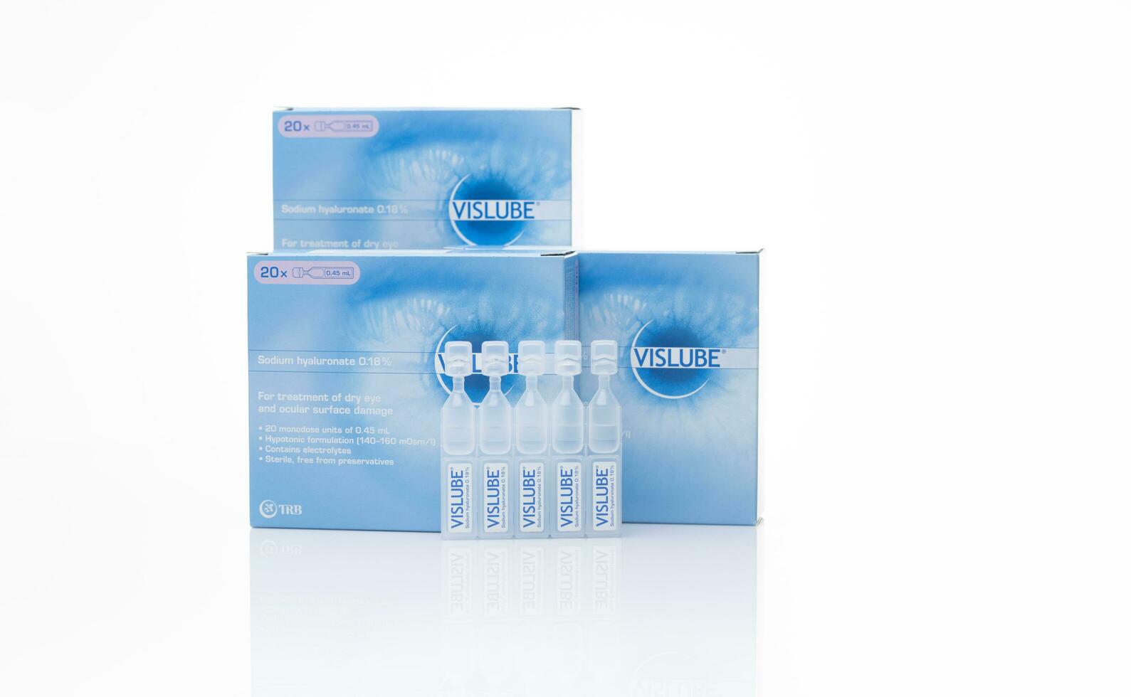 CHONBURI, THAILAND-MAY 3, 2023 Vislube artificial tears. Lubricating eye drops in plastic tube and blue package. Sodium hyaluronate eye drops for treatment dry eye. Artificial tears vial. Eye care. photo