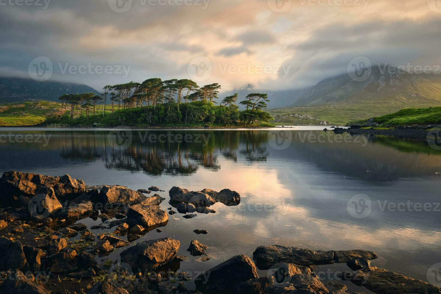 Beautiful sunrise landscape scenery of twelve pines island at Derryclare lake in Connemara National park, county Galway, Ireland photo