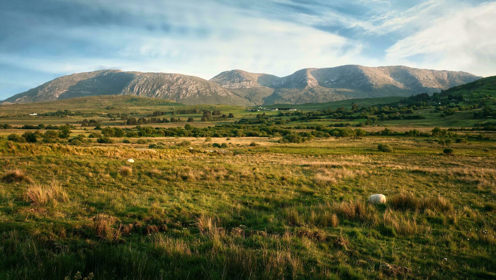 Beautiful landscape scenery of valley and mountains in the background at county Mayo, Ireland photo