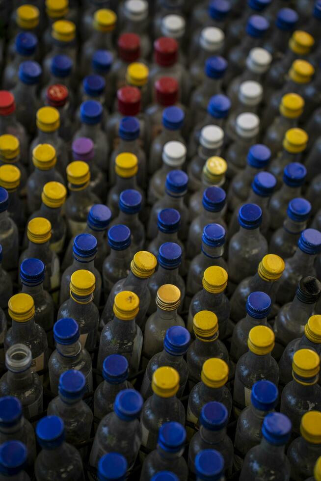 Old Glass Bottles With Colorful Tops photo