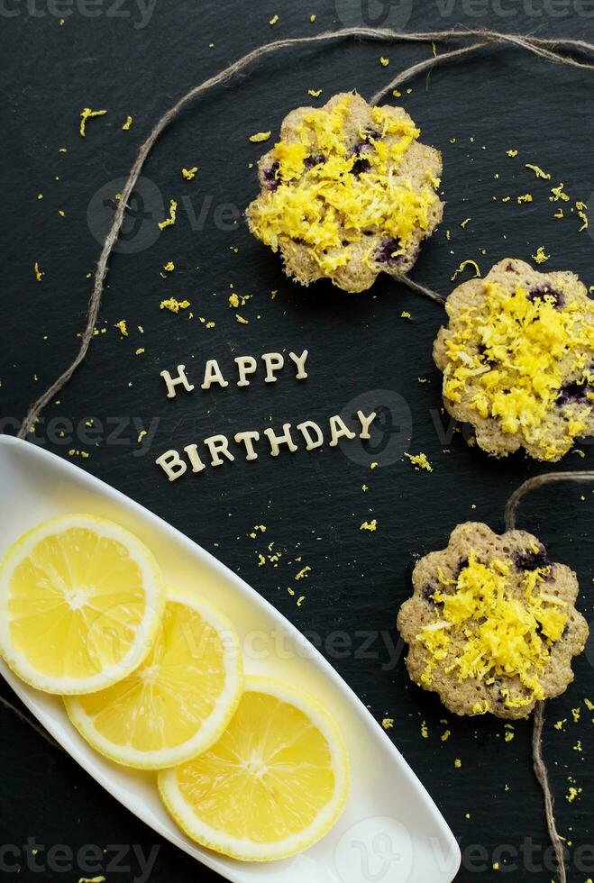 lemon cupcakes on a black background photo