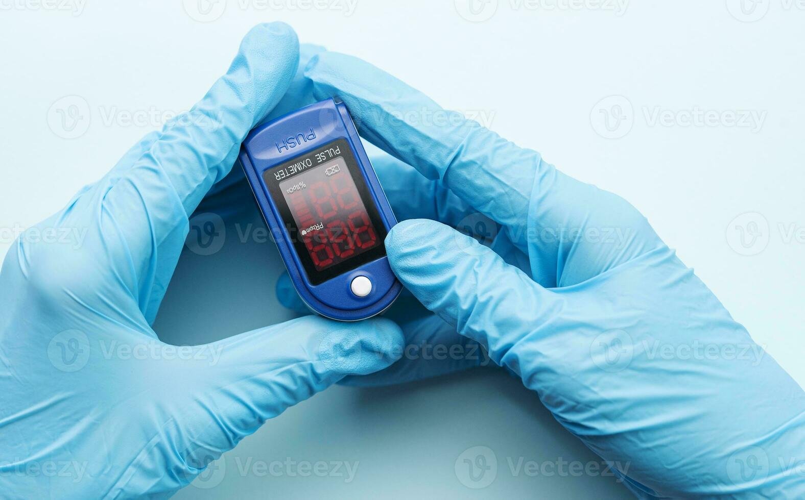 Pulse oximeter in doctor hand photo