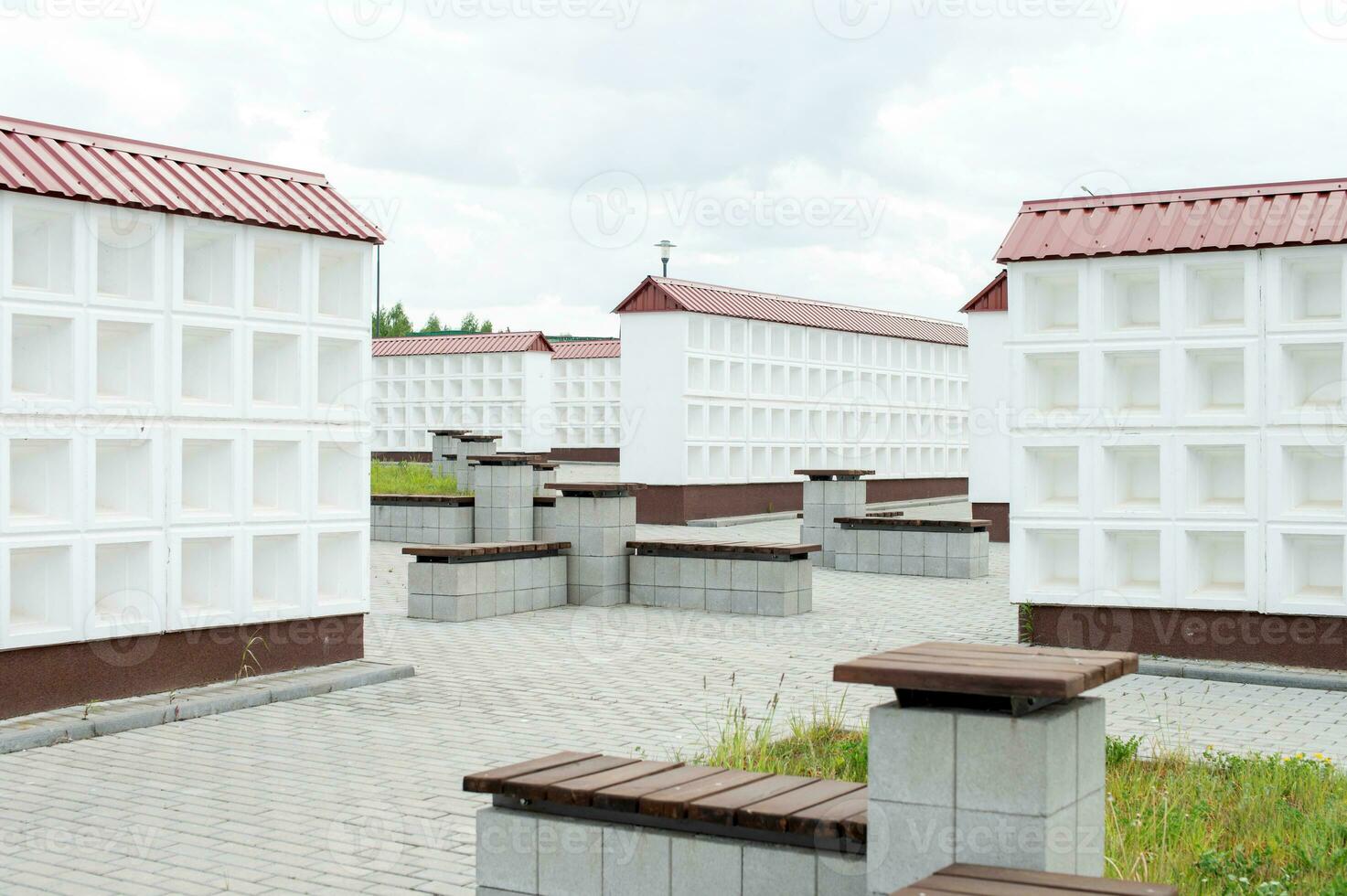 Rows of white walls for the burial of ashes after cremation. Empty boxes for urns photo