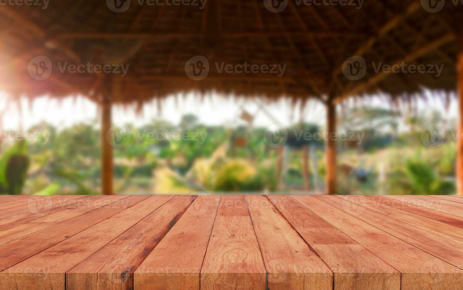 perspective wooden board over blurred green farm photo