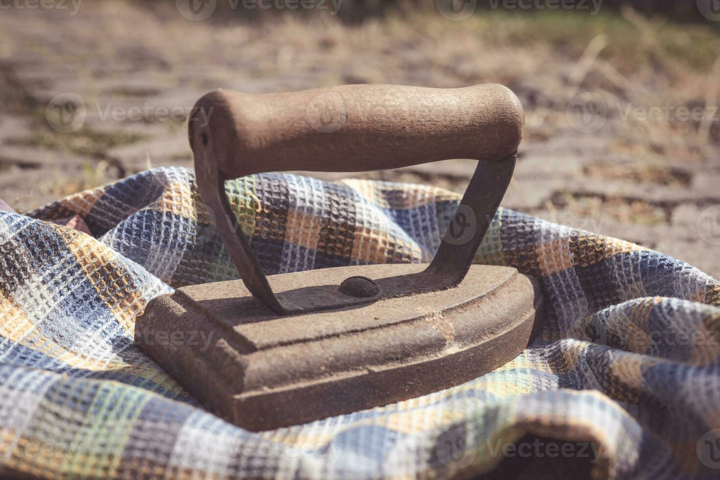 an old iron with a cloth photo