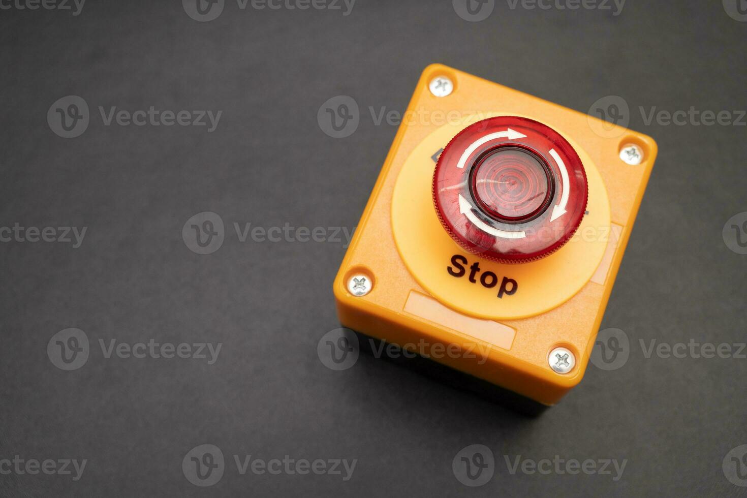 emergency stop button. Big Red emergency button or stop button for manual pressing. STOP button for industrial equipment, emergency stop. Red light. At the factory and industrial facility. photo