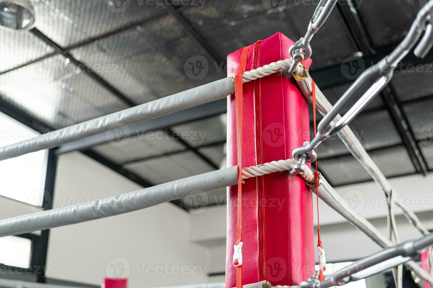 Boxing ring in the corner. Empty ring geared-up for fight boxers photo