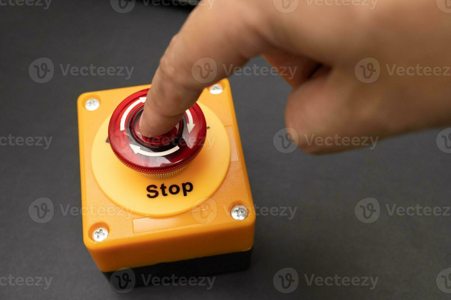 emergency stop button. Big Red emergency button or stop button for manual pressing. STOP button for industrial equipment, emergency stop. Red light. At the factory and industrial facility. photo