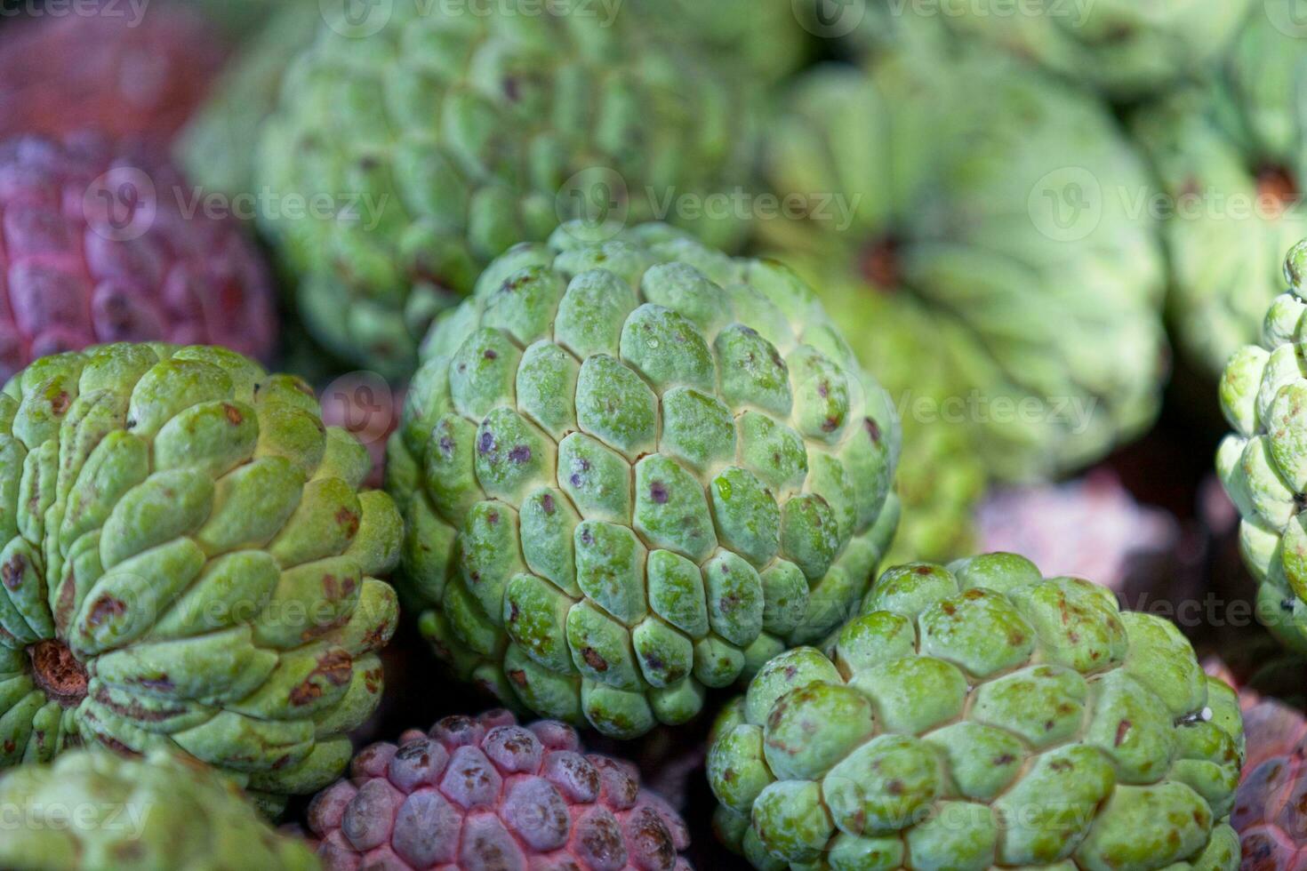 Stack of Sugar apples on a market stall photo