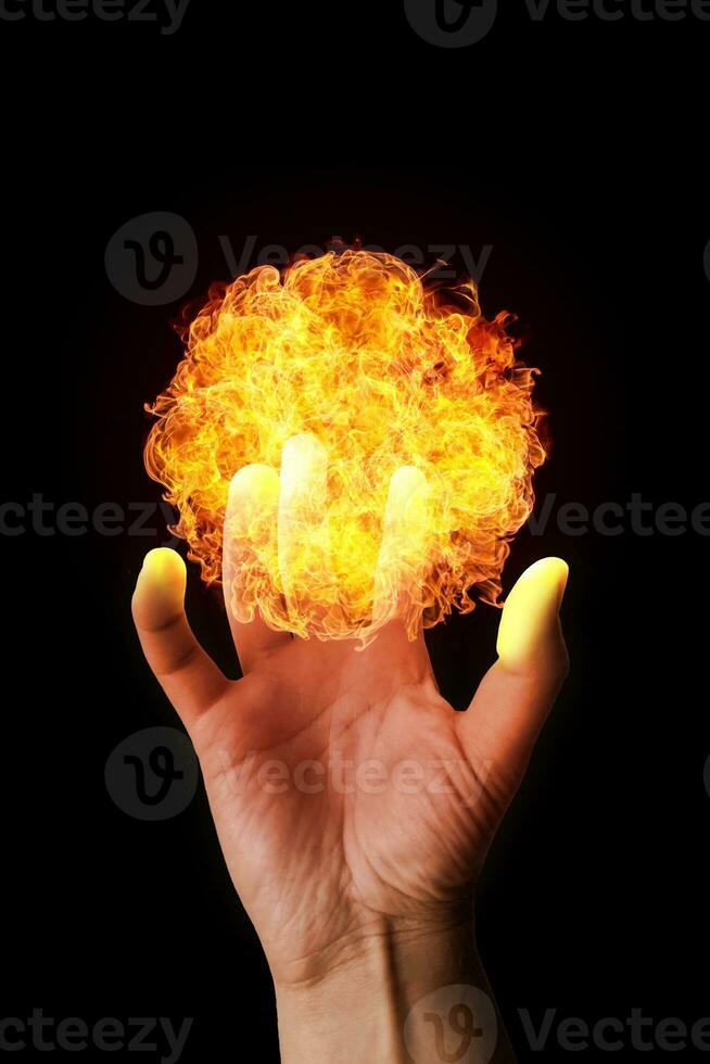 Man's hand holding a fireball photo