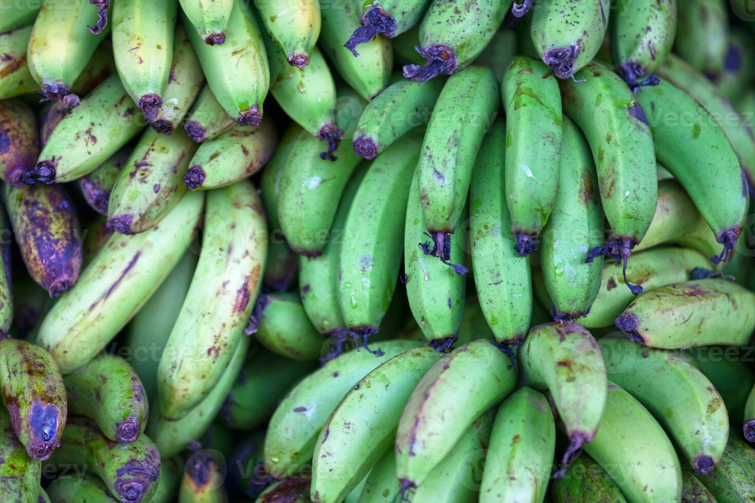 Stack of bananas on a market stall photo