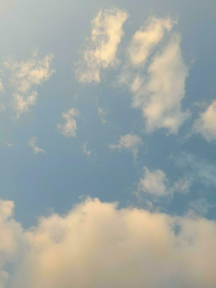 Beautiful white clouds on deep blue sky background. Large bright soft fluffy clouds are cover the entire blue sky. photo