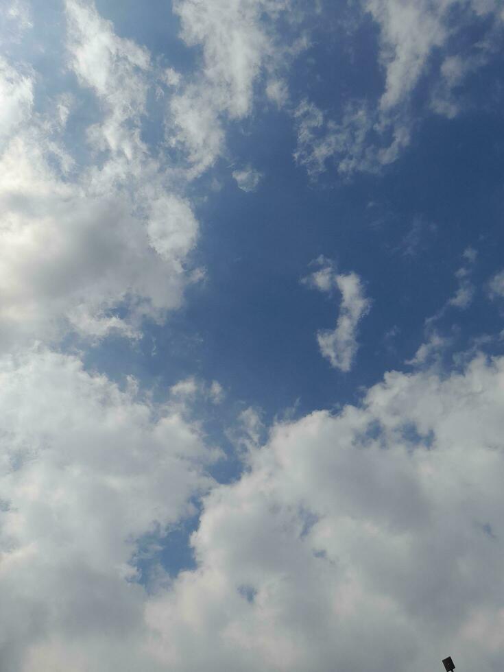 The white clouds on the blue sky are perfect for the background.  Skyscape on Lombok Island, Indonesia photo