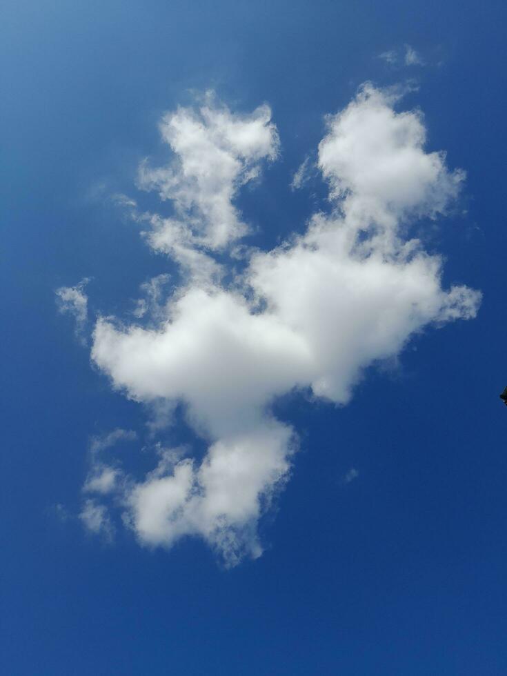 The white clouds on the blue sky are perfect for the background.  Skyscape on Lombok Island, Indonesia photo