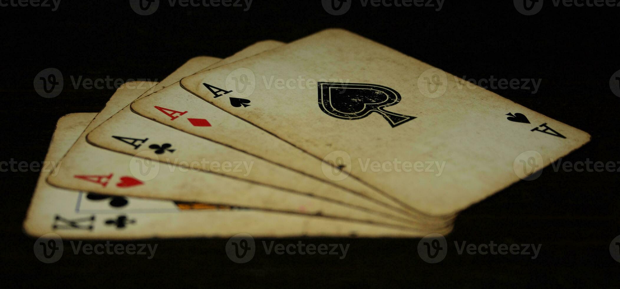 Four of a kind aces on a black background photo