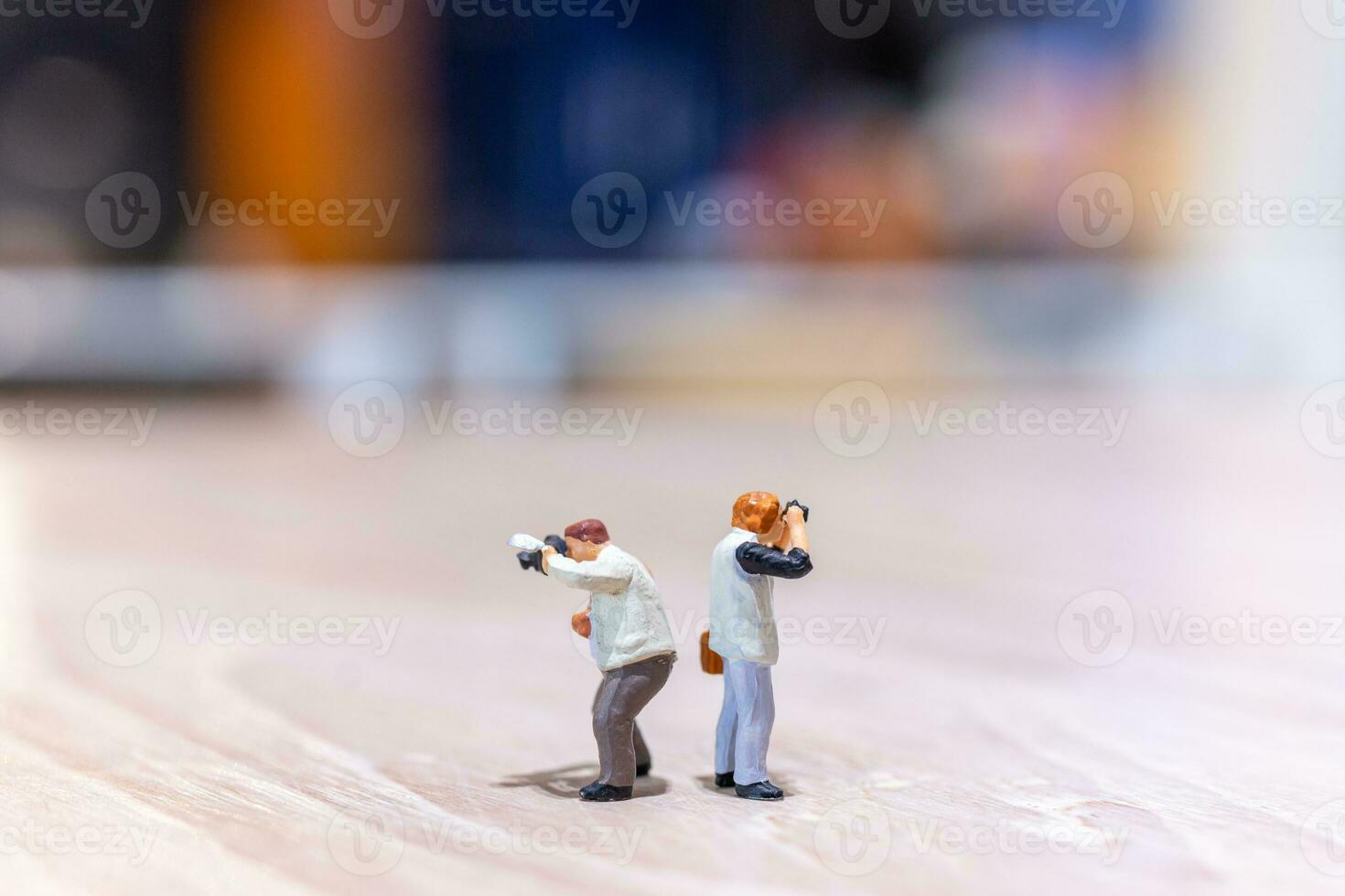 Miniature people Photography holding a camera and copy space for text photo