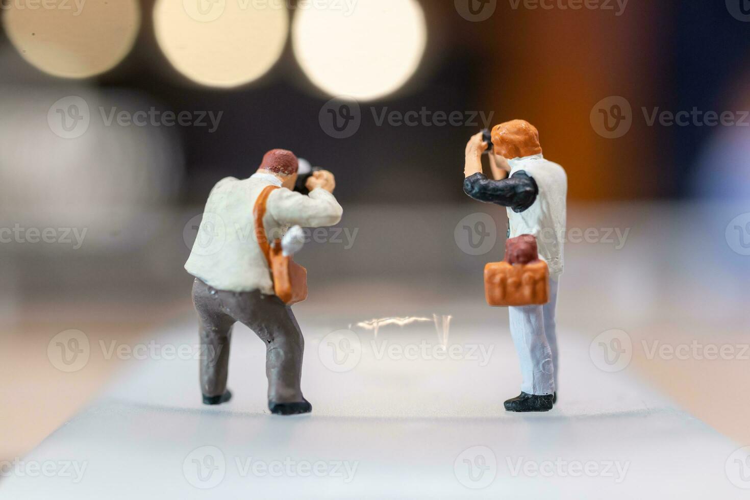 Miniature people Photography holding a camera and copy space for text photo