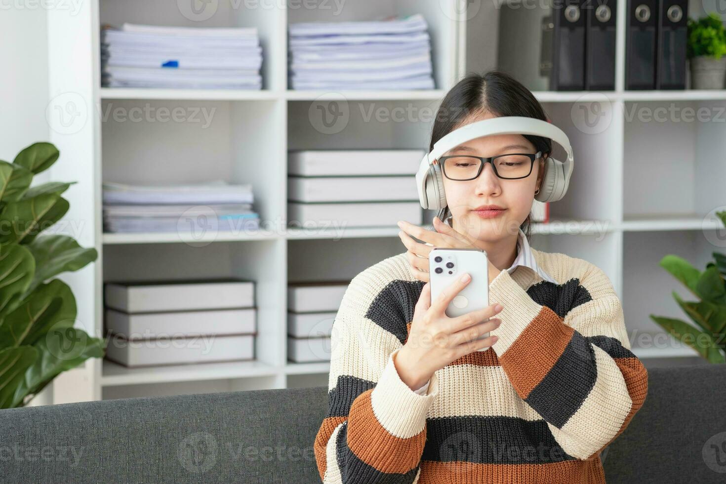 Asian girl students study online, stay at home, teacher, video call, and zoom online. Happy Asian girl learning English online with laptop computer, tablet and mobile phone. online learning concept. photo
