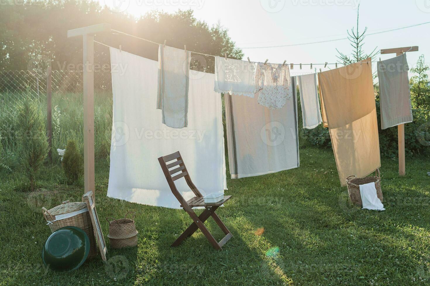 A place for drying linen, sheets and clothes on the street in the courtyard of a village house. The concept of summer, trips to the country and physical labor of women. Life in the country. photo