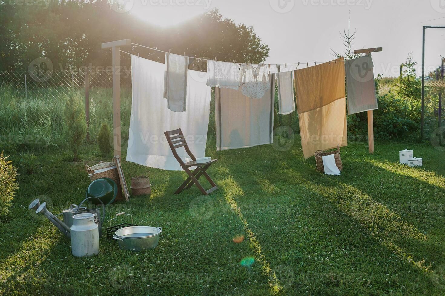 A place for drying linen, sheets and clothes on the street in the courtyard of a village house. The concept of summer, trips to the country and physical labor of women. Life in the country. photo