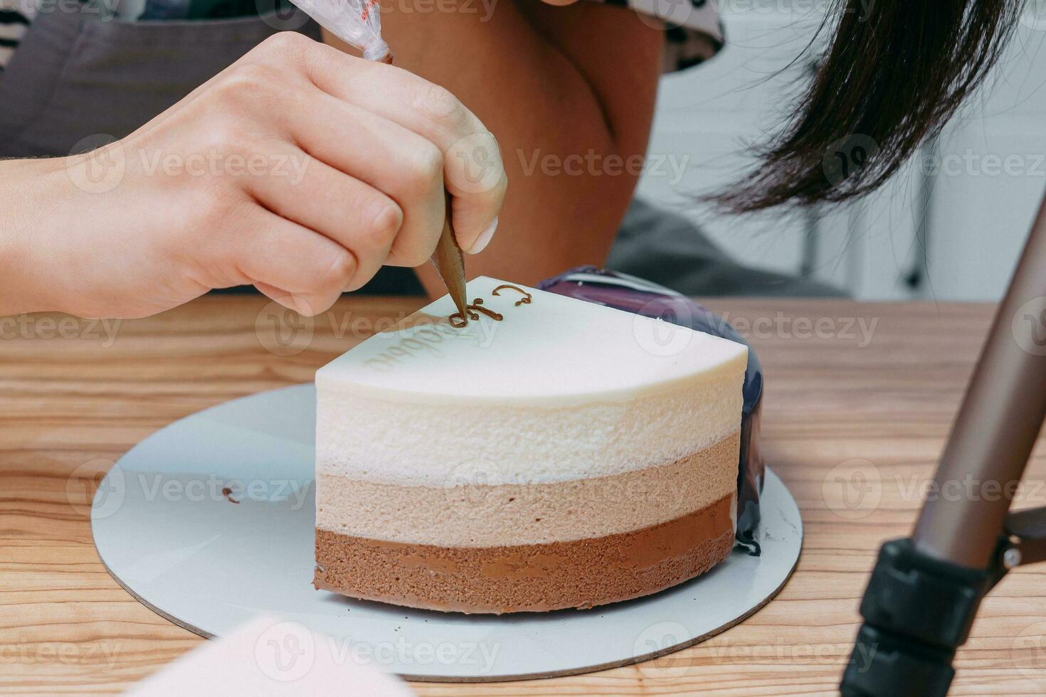 A piece of chocolate cake in the cut. Preparation of mousse cake at a culinary master class. Cooking at home, homemade food photo