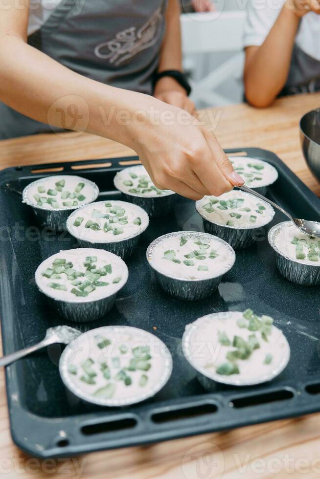 Cooking sweet cupcakes with candied fruits on the culinary MK. We cook at home photo