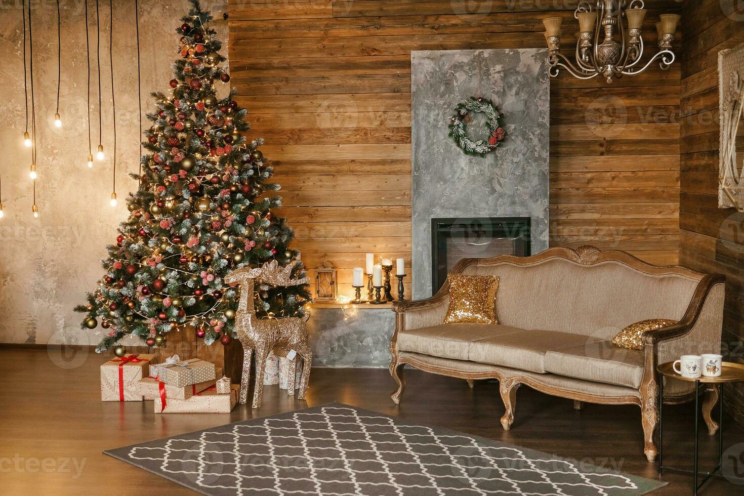 Tver, Russia-December 15, 2019. Beautiful New year's interior, Christmas tree, fireplace, gifts, garlands, Christmas lights. photo