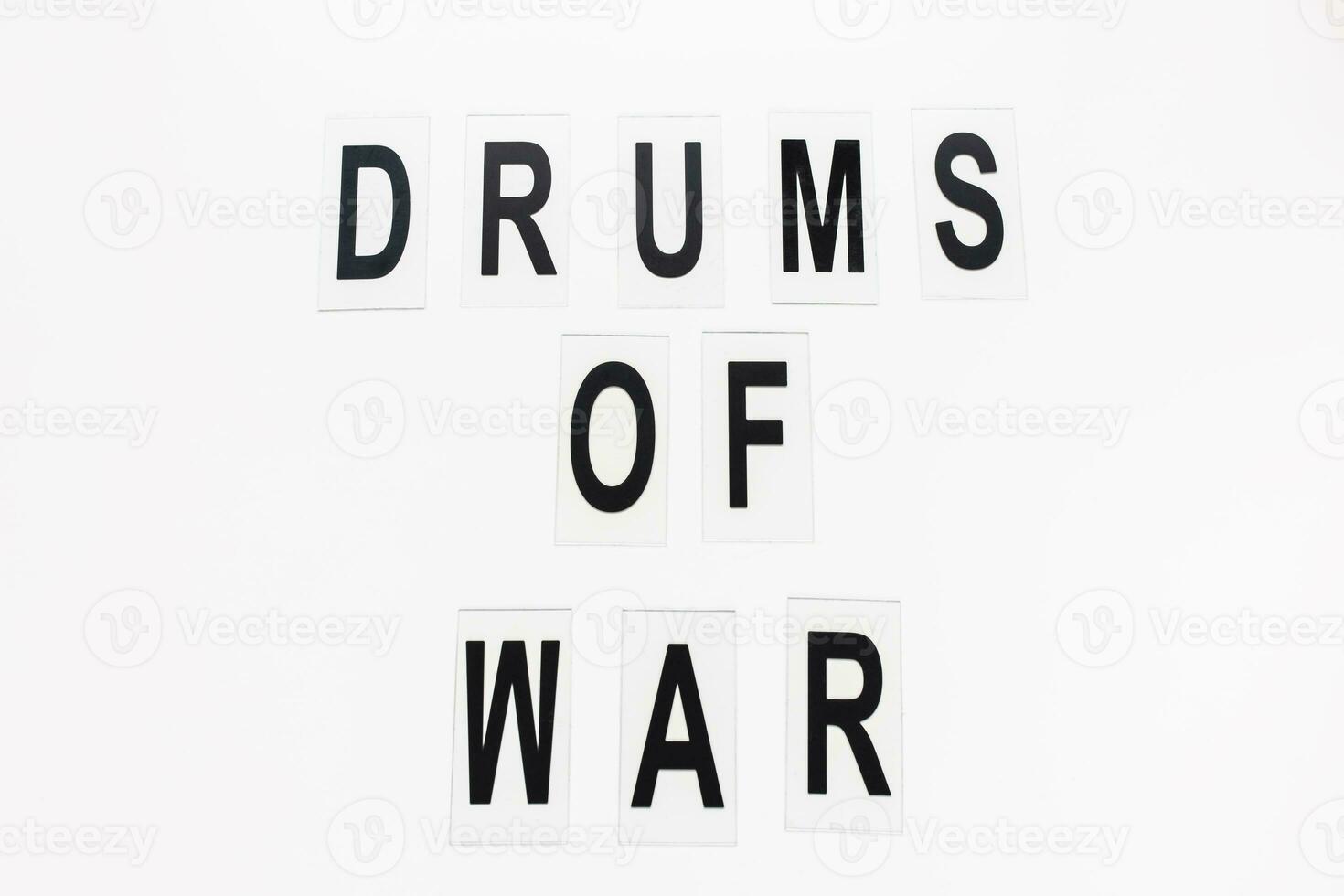 Text DRUMS OF WAR on white background, copy space photo