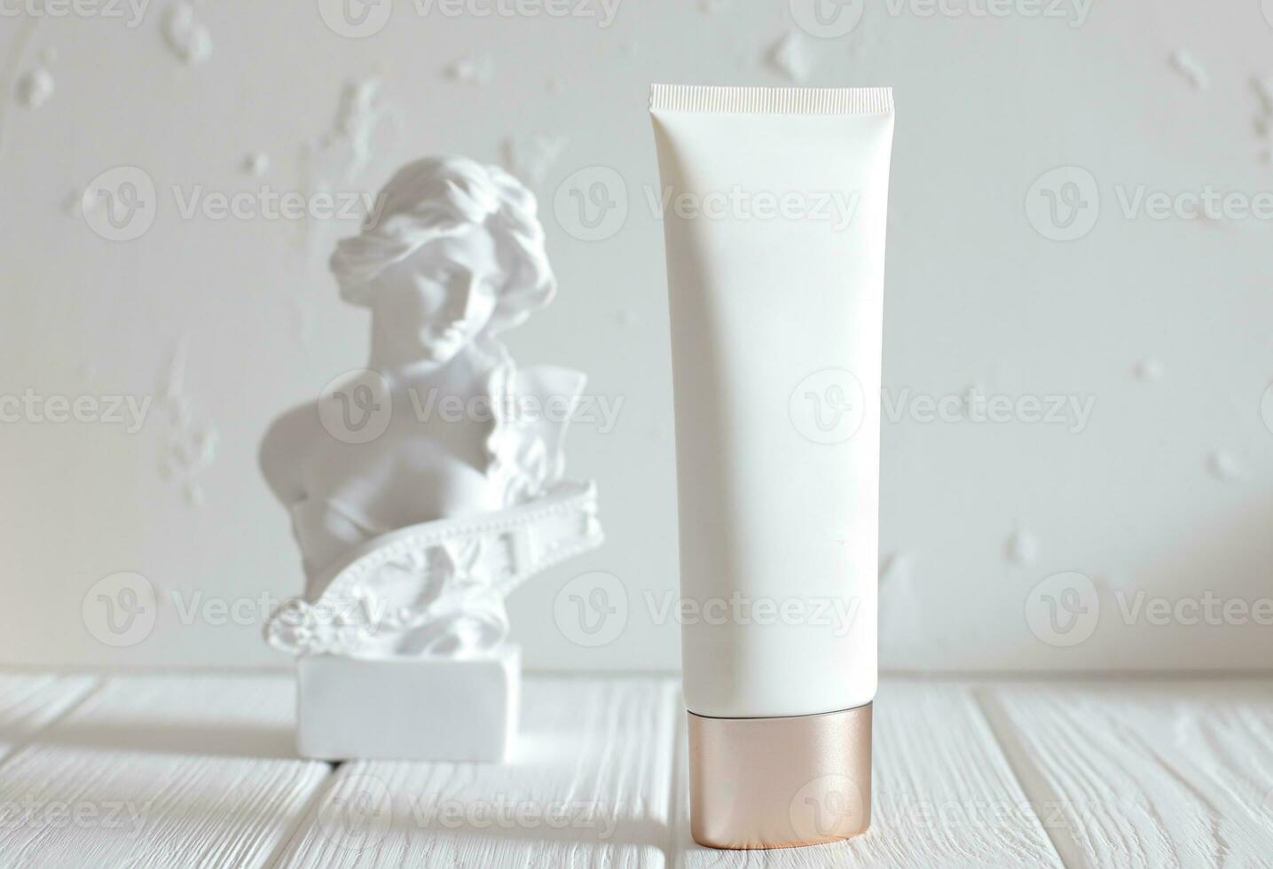 Cosmetic cream bottle and head statue on table, mockup photo