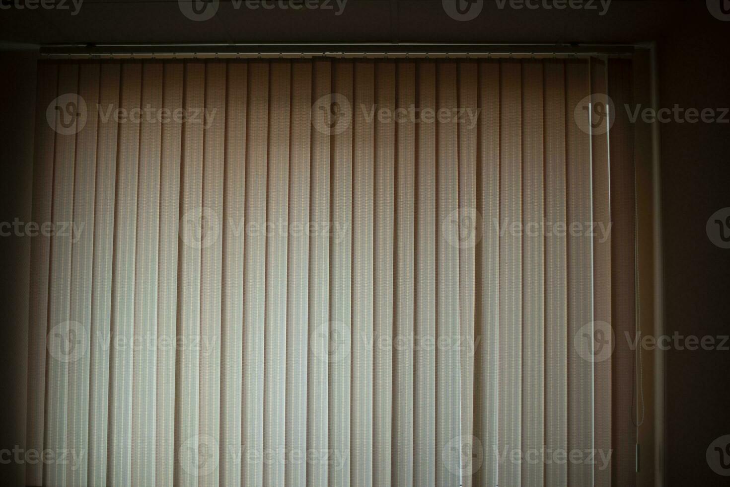 Blinds in room. Window closed from light. Blinds covered light. photo