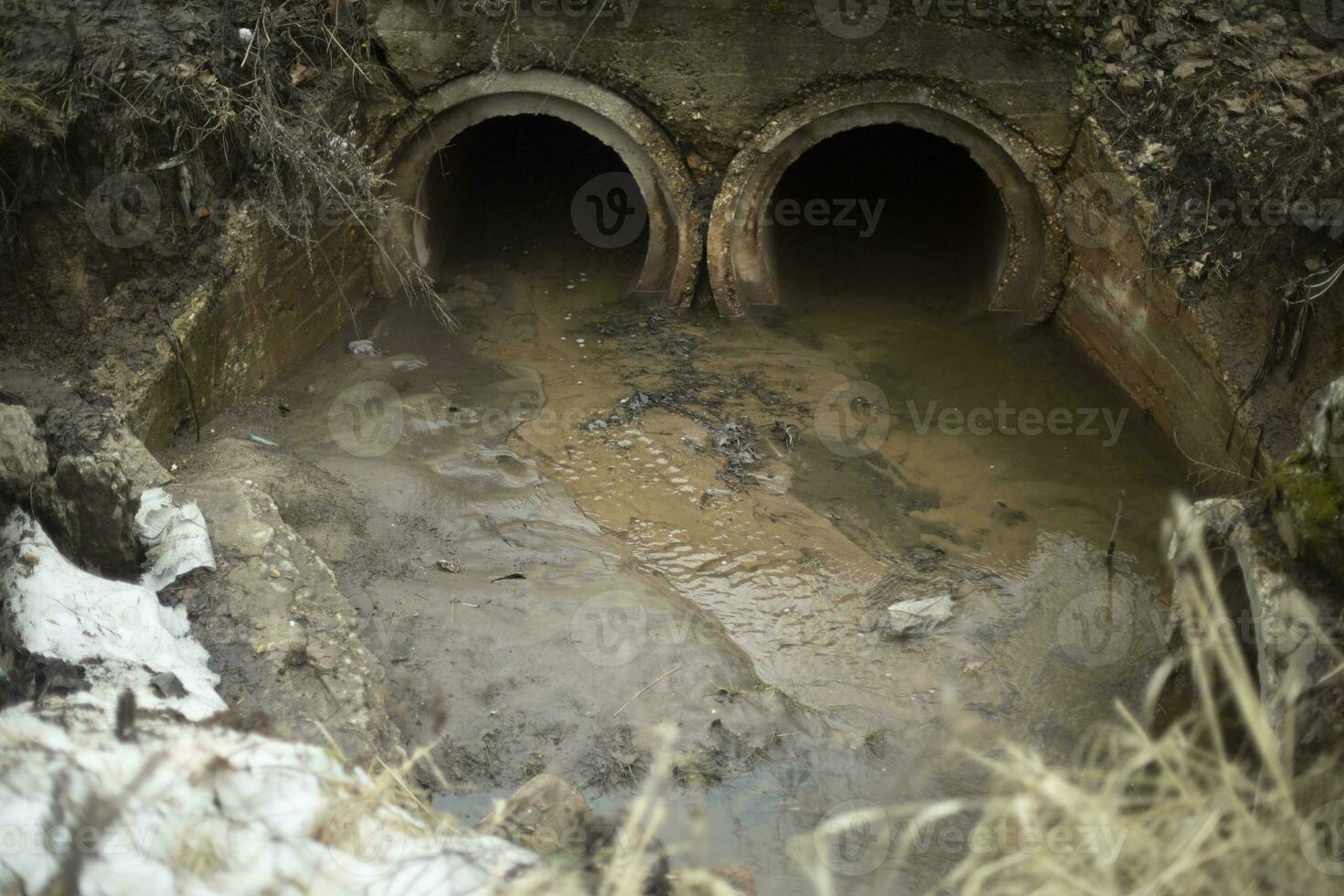 Pipes in ground. Draining water. Industrial waste. photo