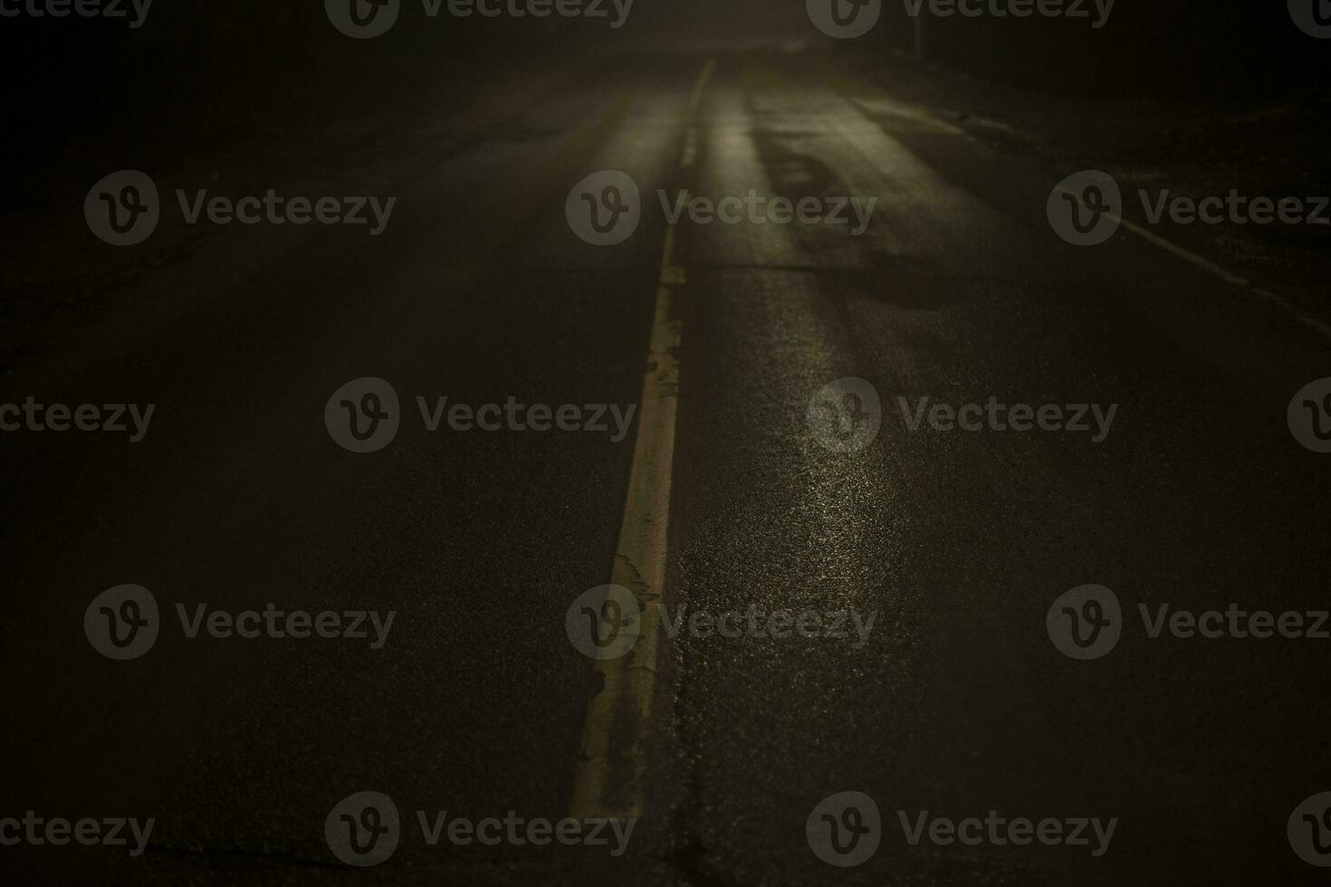 Road at night in fog. Fog on Schosse. Weak light on road in dark. photo