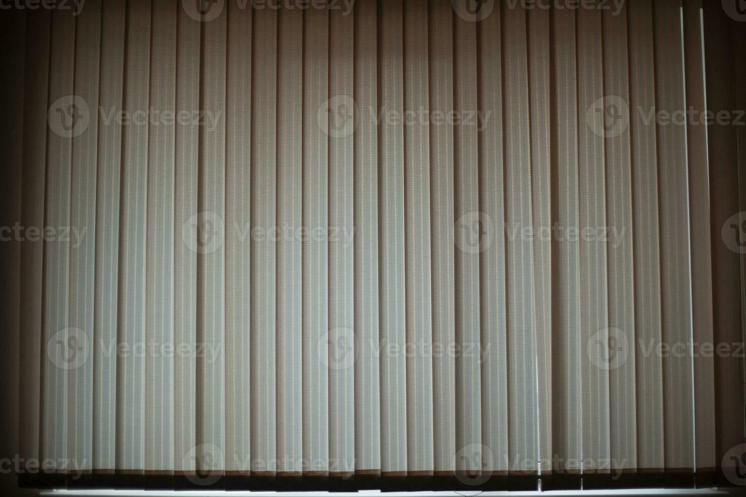 Blinds in room. Window closed from light. Blinds covered light. photo