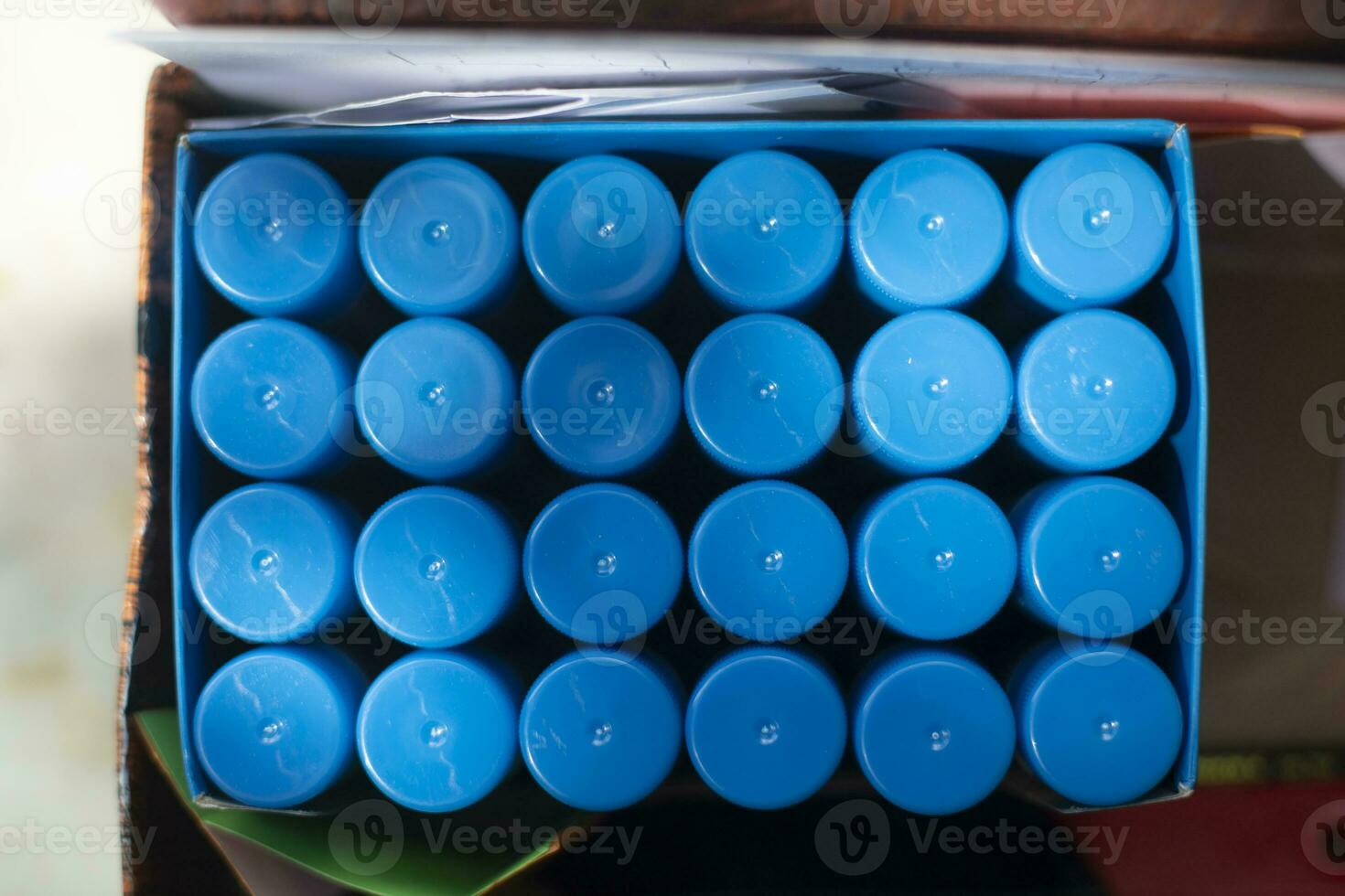 Glue in package. Many packs of glue. Blue Objects. 24947708 Stock Photo